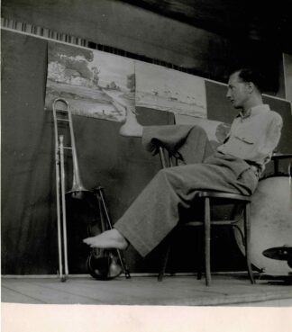 Press photograph of Maurice ... painting with his foot