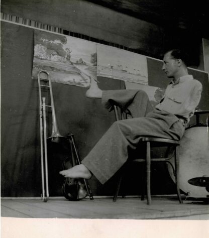 Press photograph of Maurice ... painting with his foot