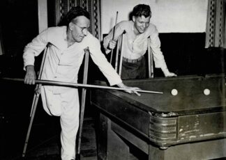 Press photograph of two men playing billiard