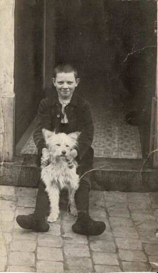 Boy posing with dog - undated