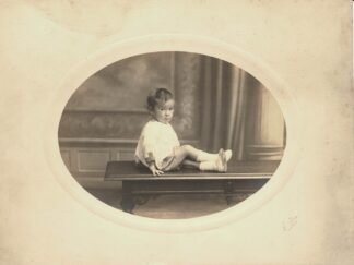 Girl sitting on a table - undated