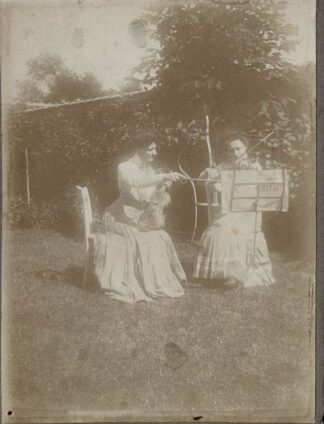 Two ladies playing mozart on the violin - undated